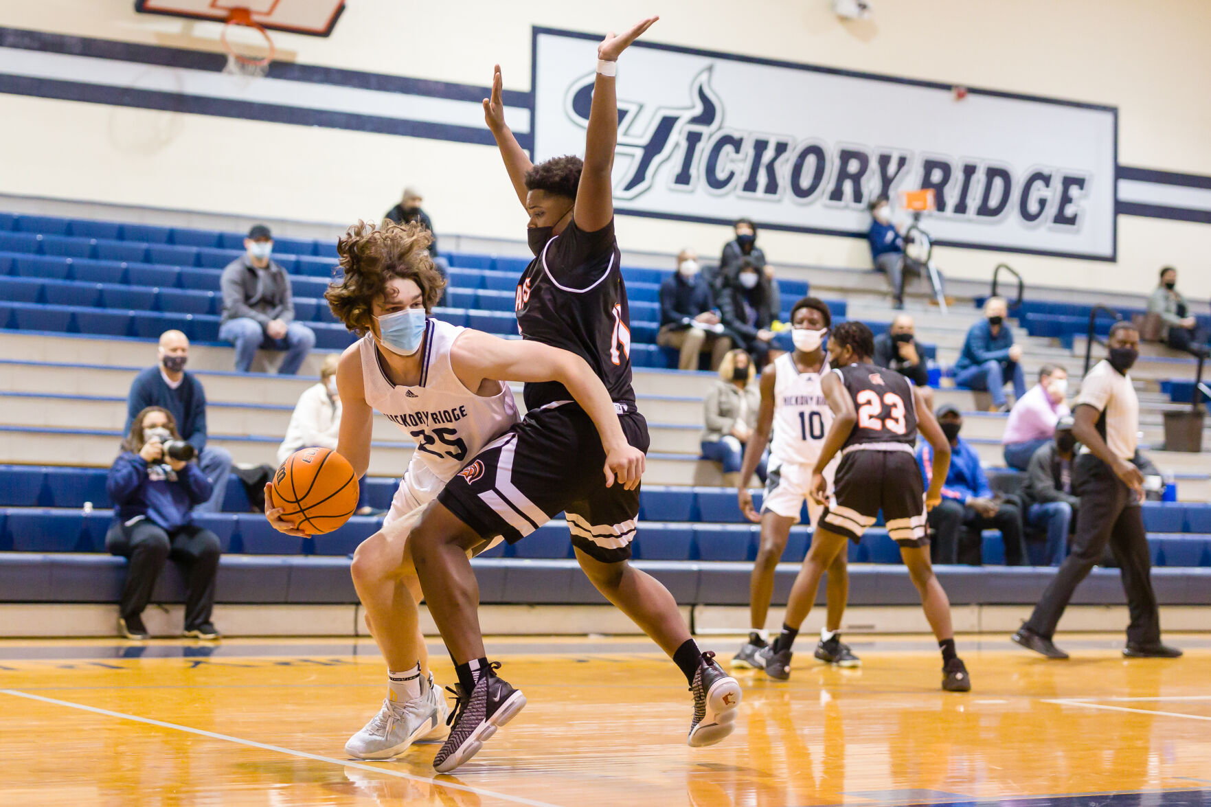Boys Basketball: Hickory Ridge RaginÕ Bulls defeated the Northwest Cabarrus Trojans 64-56.